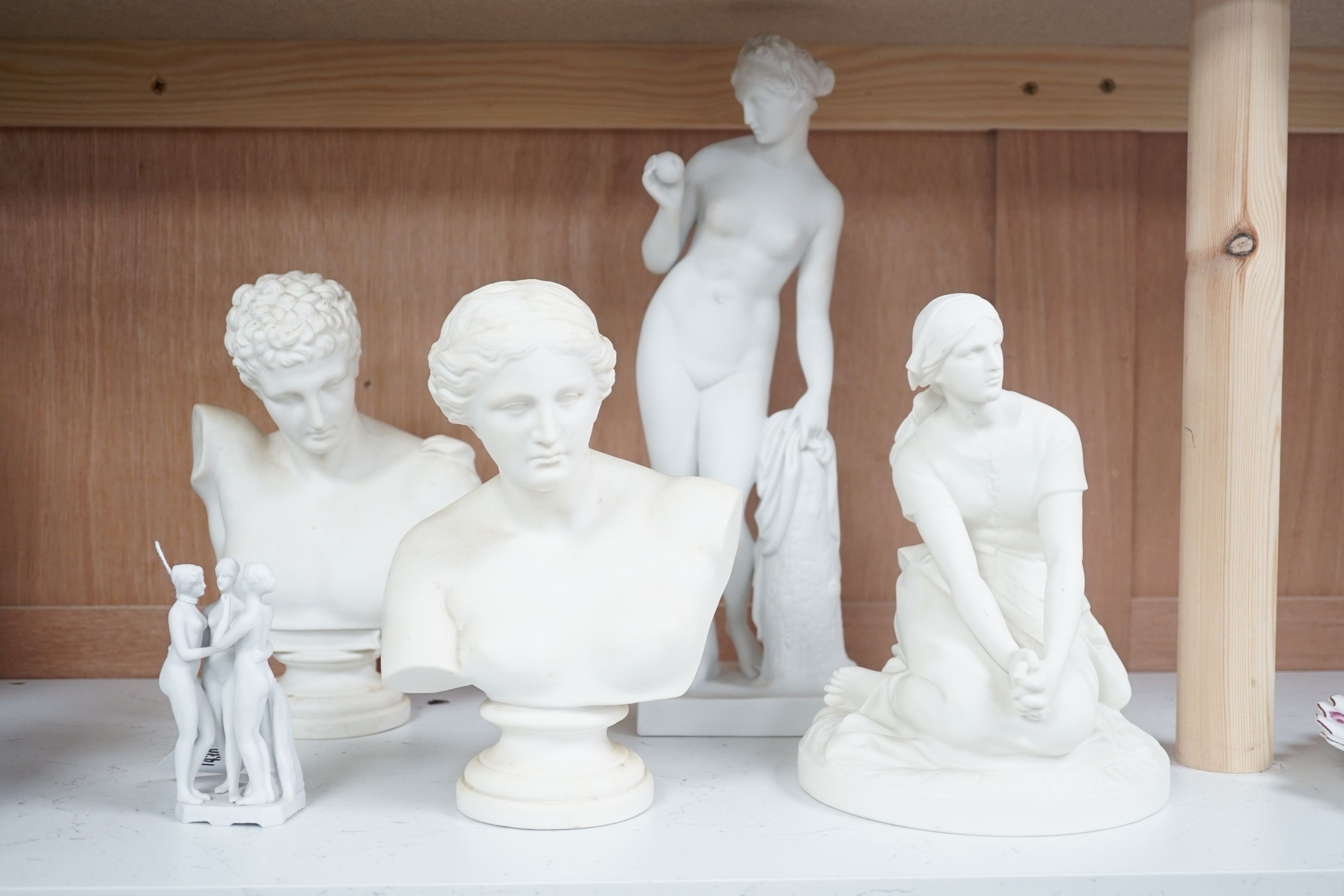 Two parian busts, a classical figure, another seated figure and a miniature three graces group, to include Gustavsberg - tallest 33cm